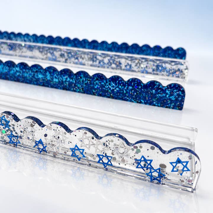 Star of David mahjong rack pushers — clear acrylic pushers with blue Star of David shapes and scalloped edges