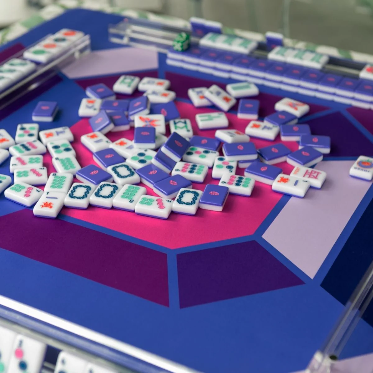 The Gem travel mahjong mat in amethyst violet — faceted jewels one side, Jewel Collection reverse