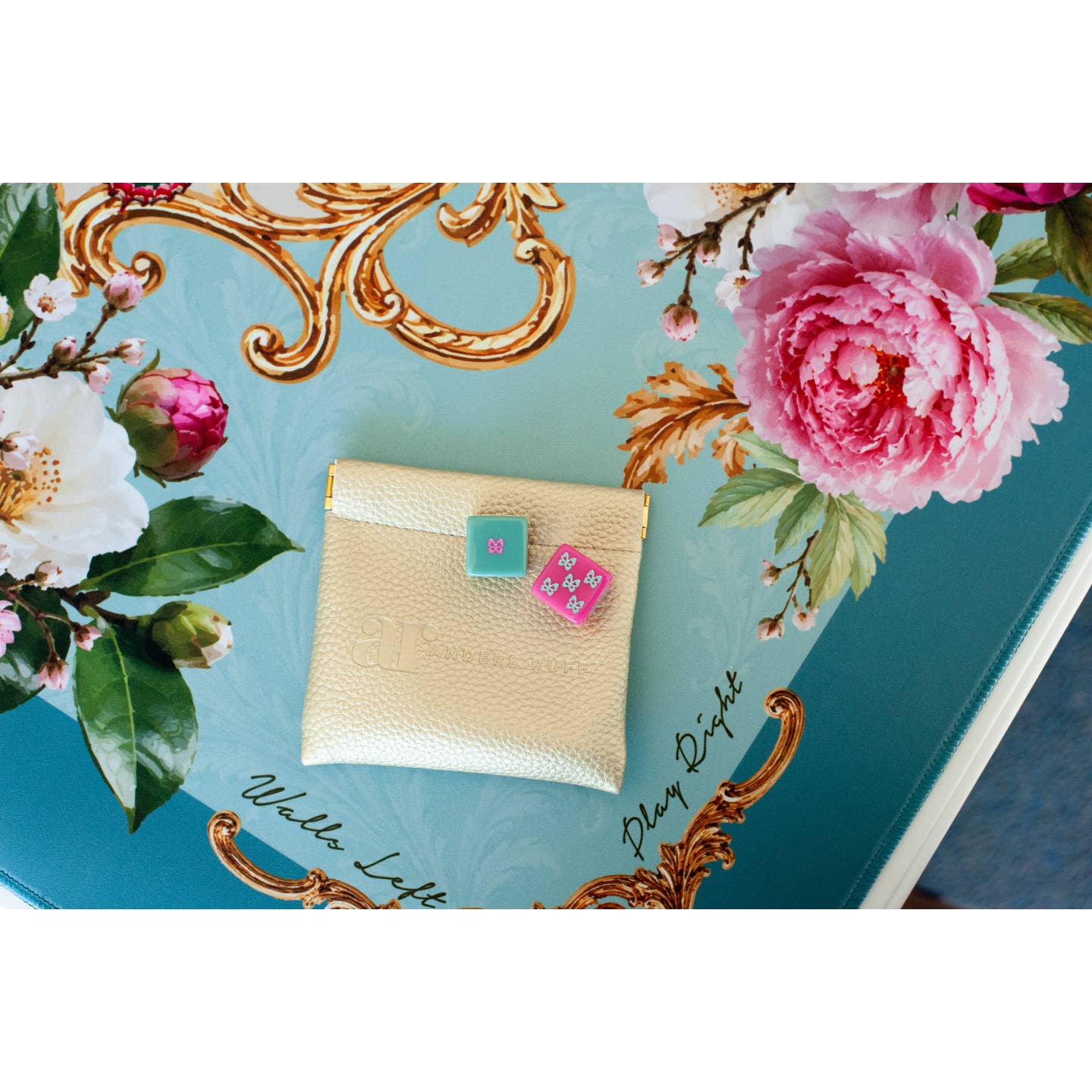 Mahj in Bloom dice pouch and butterfly dice on the vintage aqua mat