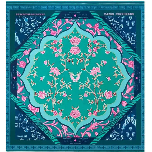 Teal American mahjong mat with pink botanical florals in a central medallion, decorative geometric border, and corner floral panels