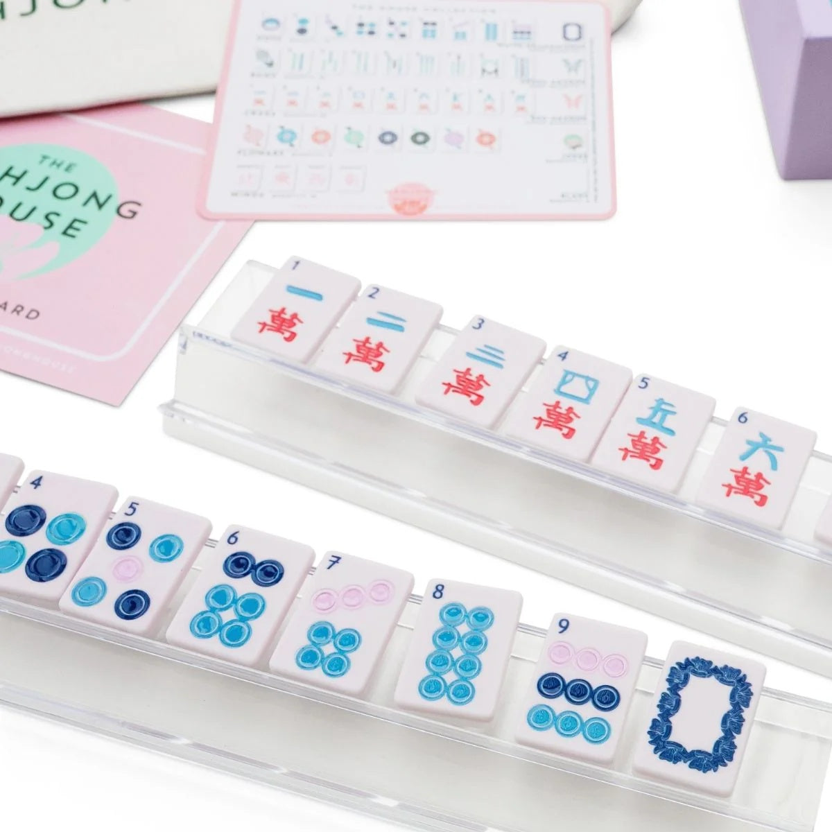 Lavender travel mahjong craks and dots on clear racks with House Card and tile guide