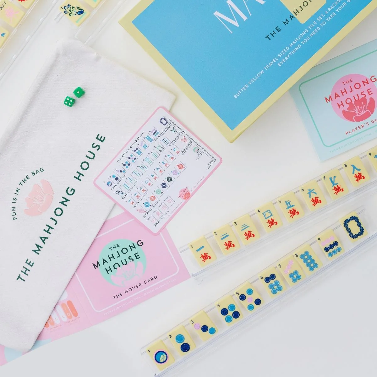 Butter Yellow Travel Mahjong Set flat lay with box, travel bag, House Card, guides and racks