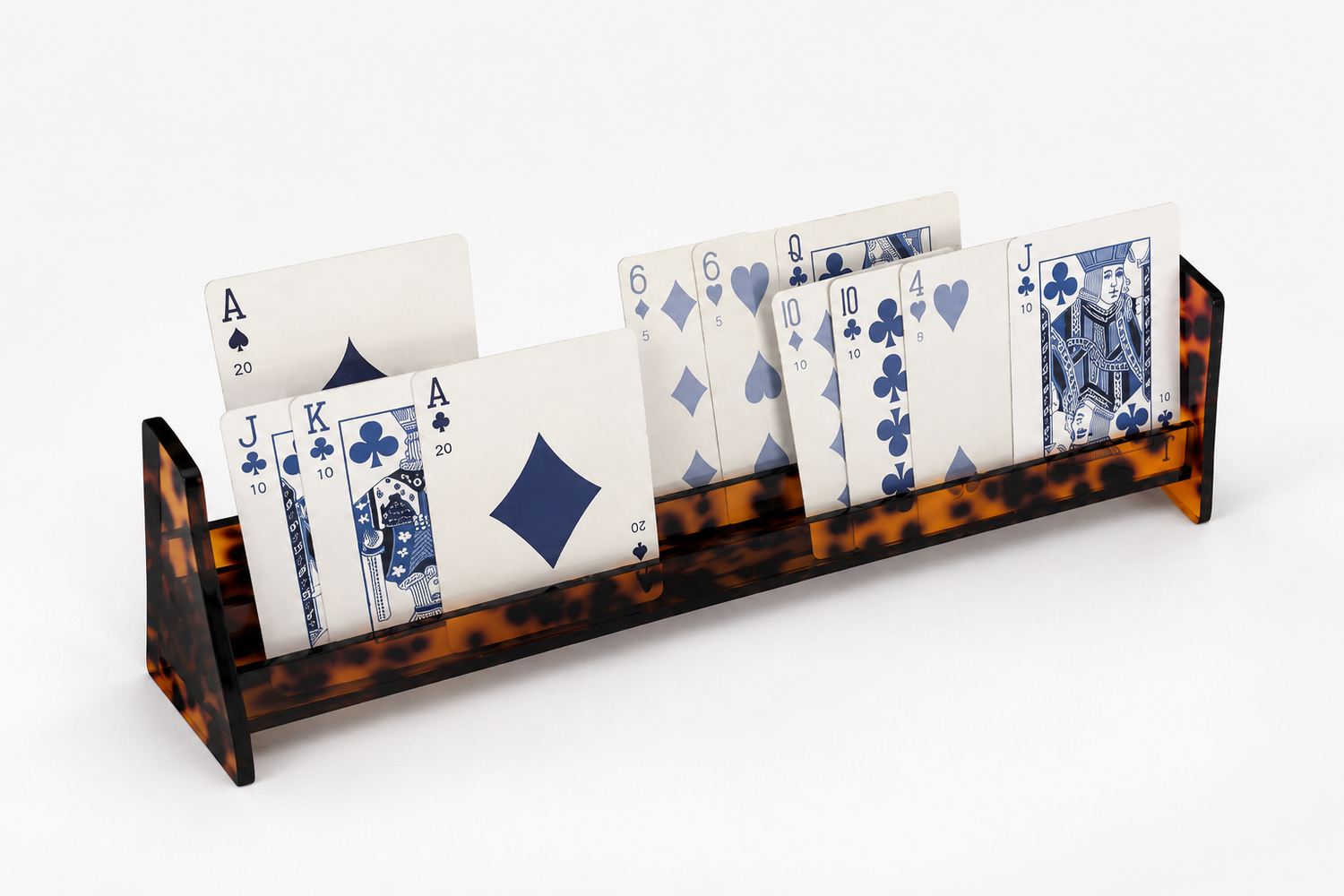 Tortoise acrylic canasta card rack holding a full hand of cards