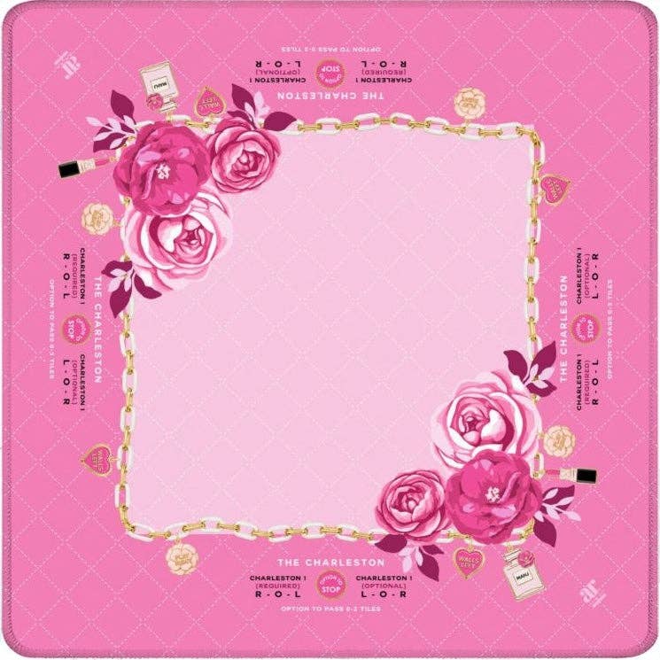 Charming Blooms mahjong mat with blush-pink quilting, pink peonies, gold chain border, and enamel charms