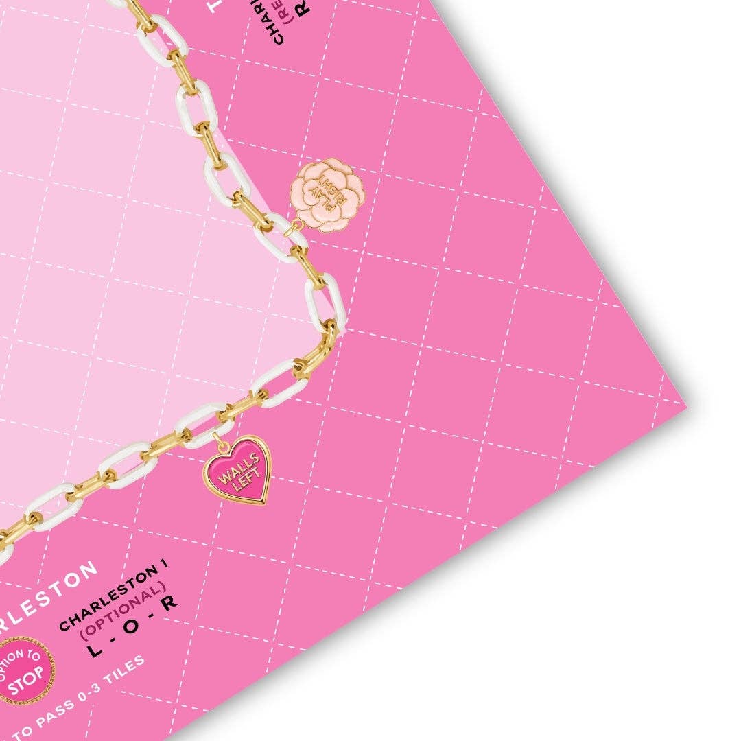 Close-up of the gold chain border and enamel heart charms on the Charming Blooms mahjong mat