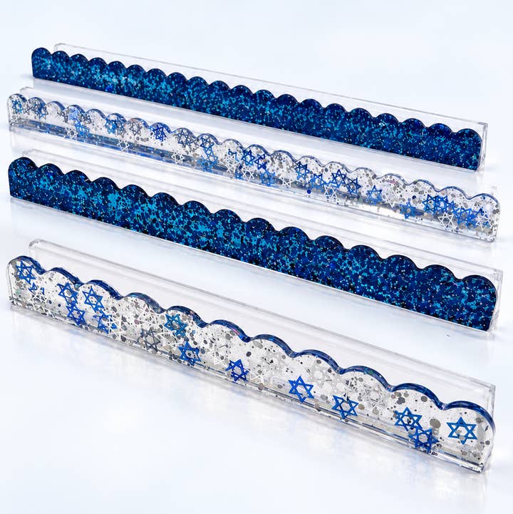 Set of four Star of David mahjong rack pushers — two blue glitter and two clear with blue stars on clear racks