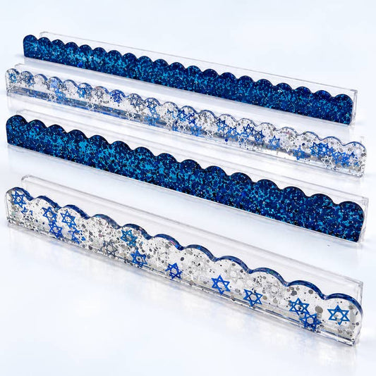 Set of four blue and silver glitter mahjong rack pushers on clear acrylic racks