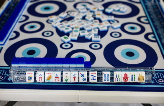 Detail of the evil eye pattern and hamsa border on the Evil Eye mahjong mat