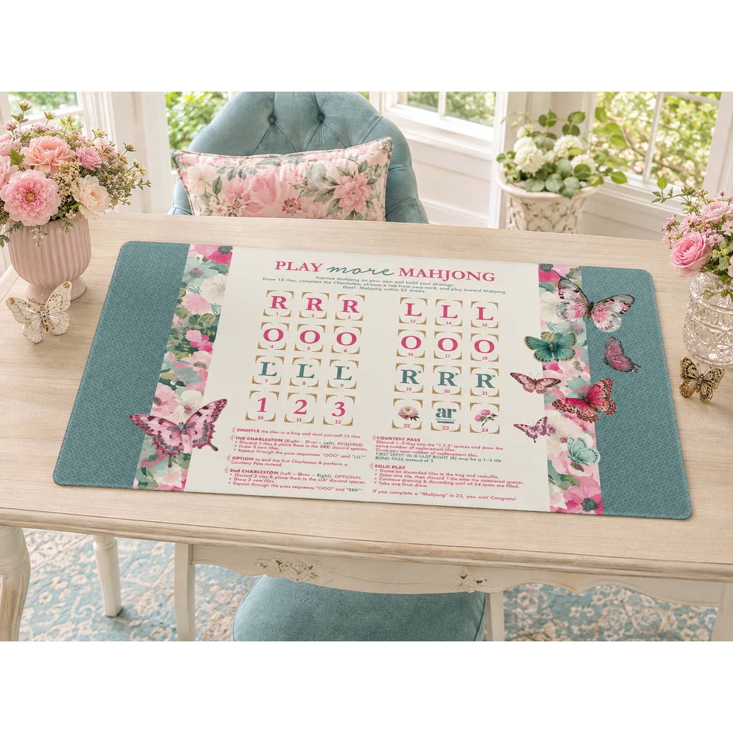 Mahj in Bloom solo play mahjong mat styled on a table with flowers